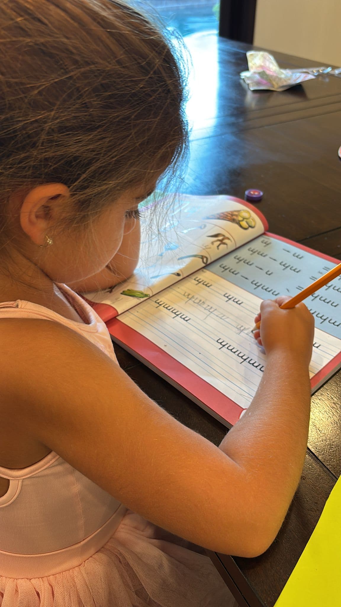 Children learning Armenian on a tablet